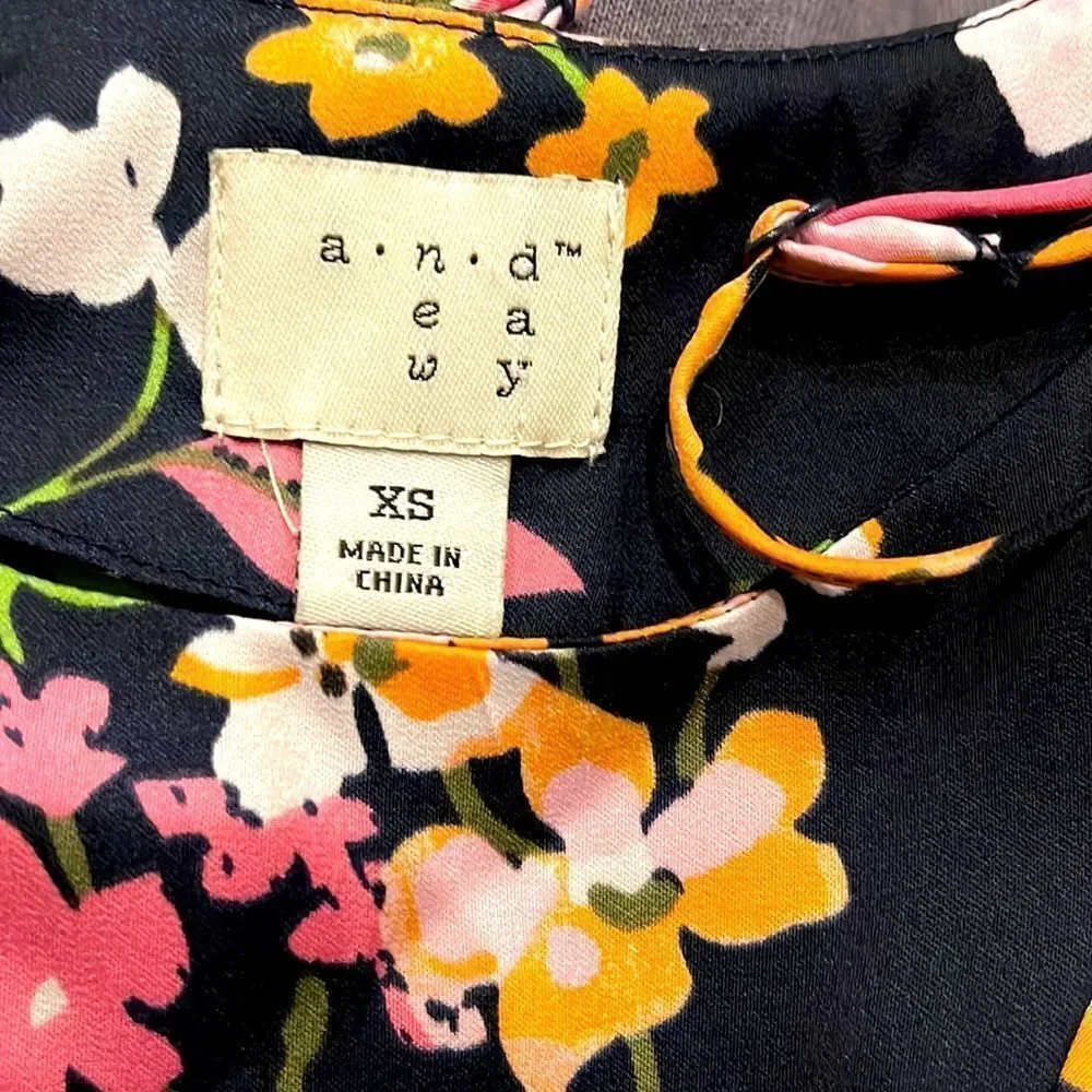 A New Day Floral Tank‎ w/ruffle in front. Size XS